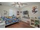 Nicely decorated bedroom with fan and modern flooring at 10423 W Hughes Dr, Tolleson, AZ 85353