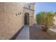 The home's walkway leads to a front door surrounded by desert landscaping at 10423 W Hughes Dr, Tolleson, AZ 85353