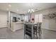 Modern kitchen with grey cabinetry, an island, and stainless steel appliances at 10423 W Hughes Dr, Tolleson, AZ 85353