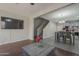 A living room opens to the kitchen and dining area with seamless flooring transition at 10423 W Hughes Dr, Tolleson, AZ 85353