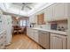 Updated kitchen featuring stone countertops, wooden floors, and stainless steel appliances at 10461 W Loma Blanca Dr, Sun City, AZ 85351