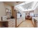 Eat-in kitchen features lots of counter space, seating and light-colored cabinetry at 10461 W Loma Blanca Dr, Sun City, AZ 85351