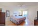 Comfortable bedroom with natural light and hardwood floors at 10461 W Loma Blanca Dr, Sun City, AZ 85351