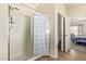 Bathroom featuring glass enclosed shower and tile floors at 10684 N 161St Ave, Surprise, AZ 85379