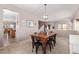 Charming dining area with a wooden table and view into the adjacent spaces at 10684 N 161St Ave, Surprise, AZ 85379