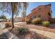 Two-story home with a tile roof, desert landscaping, and a detached garage at 10684 N 161St Ave, Surprise, AZ 85379