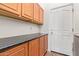 Laundry room featuring counter space and upper cabinets for storage at 10684 N 161St Ave, Surprise, AZ 85379