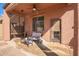 Cozy covered patio with outdoor seating, perfect for relaxing and enjoying the fresh air at 10684 N 161St Ave, Surprise, AZ 85379