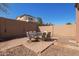 Outdoor dining area with a large table and chairs, ideal for entertaining guests at 10684 N 161St Ave, Surprise, AZ 85379