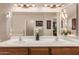 Bathroom with dual sinks and a decorative plant at 11530 E Monterey Ave, Mesa, AZ 85209