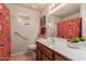 Bathroom featuring bright light fixtures, a decorative shower curtain, and a large mirror at 11530 E Monterey Ave, Mesa, AZ 85209