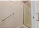 Bathroom boasts a standalone shower with safety bars and grab handles at 11530 E Monterey Ave, Mesa, AZ 85209