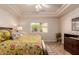 Bright bedroom with a decorative ceiling fan at 11530 E Monterey Ave, Mesa, AZ 85209