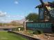 A sunny Sunland Springs Village sign welcomes residents and guests to this active adult living community at 11530 E Monterey Ave, Mesa, AZ 85209