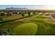 Scenic view of a meticulously maintained golf course with lush green fairways at 11530 E Monterey Ave, Mesa, AZ 85209