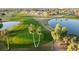 Aerial view showcasing the pristine golf course, lakes, and manicured lawns at 11530 E Monterey Ave, Mesa, AZ 85209