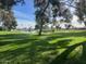 Scenic view of the well-manicured golf course with trees at 11530 E Monterey Ave, Mesa, AZ 85209