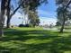 The golf course features lush green grass and mature trees, providing a scenic and challenging experience at 11530 E Monterey Ave, Mesa, AZ 85209