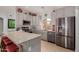 Well-lit kitchen with stainless steel appliances and a large island at 11530 E Monterey Ave, Mesa, AZ 85209