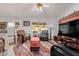 Comfortable living room with ceiling fan, TV, and modern decor at 11530 E Monterey Ave, Mesa, AZ 85209