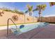 Sparkling pool with tiled wall art and well-manicured landscaping for relaxation at 11530 E Monterey Ave, Mesa, AZ 85209