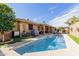 Backyard pool features a well-maintained pool with a patio, BBQ, and ample space for outdoor entertaining at 11530 E Monterey Ave, Mesa, AZ 85209