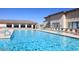 Community swimming pool surrounded by lounge chairs, offering a relaxing resort-style experience at 11530 E Monterey Ave, Mesa, AZ 85209