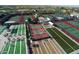 Aerial view of Sunland Spring's tennis, basketball, shuffleboard, and bocce ball courts at 11530 E Monterey Ave, Mesa, AZ 85209