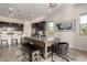 Dining area with a billiard table, stylish chairs, and modern lighting at 12413 W Calle De Baca --, Peoria, AZ 85383