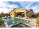 Backyard pool featuring water features, a covered patio, and ample outdoor seating at 12413 W Calle De Baca --, Peoria, AZ 85383