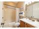 Cozy bathroom featuring a tub with shower and vanity with neutral color palette at 12835 W Black Hill Rd, Peoria, AZ 85383