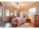 Bedroom features hardwood floors, natural light, and a ceiling fan at 12835 W Black Hill Rd, Peoria, AZ 85383