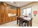 Dining area boasts custom cabinets and a sliding glass door to an outdoor patio at 12835 W Black Hill Rd, Peoria, AZ 85383