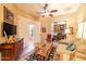 Comfortable living room with a ceiling fan and view of a built-in desk area at 12835 W Black Hill Rd, Peoria, AZ 85383