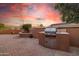 Outdoor kitchen on a brick patio with a grill, sink, and counter space at 12835 W Black Hill Rd, Peoria, AZ 85383