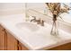 Bathroom featuring white countertops, a sink, and oak cabinets at 12936 W Sola Dr, Sun City West, AZ 85375