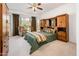 Comfortable bedroom featuring a ceiling fan and decorative window treatments at 12936 W Sola Dr, Sun City West, AZ 85375