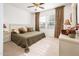 Bright bedroom with an olive-colored comforter and patterned window coverings at 12936 W Sola Dr, Sun City West, AZ 85375