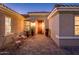 Inviting front courtyard featuring beautiful brick pavers and decorative plants at 12936 W Sola Dr, Sun City West, AZ 85375