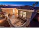 View of private courtyard showing brick pavers, stone fountain, and outdoor seating at 12936 W Sola Dr, Sun City West, AZ 85375