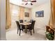 Cozy dining room featuring a round table and stylish black chairs at 12936 W Sola Dr, Sun City West, AZ 85375