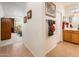 Inviting hallway with tile flooring leads to the bathroom and bedroom at 12936 W Sola Dr, Sun City West, AZ 85375