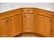 Kitchen cabinet with light oak trim and white countertop at 12936 W Sola Dr, Sun City West, AZ 85375