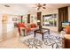 Open living room with tile floors and a view into the dining area at 12936 W Sola Dr, Sun City West, AZ 85375