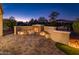 Backyard outdoor fireplace with seating on a brick patio at 12936 W Sola Dr, Sun City West, AZ 85375