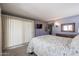 Relaxing bedroom with soft lighting, a window with drapes, and a television for entertainment at 13232 W Ballad Dr, Sun City West, AZ 85375