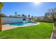 This private backyard features a refreshing in-ground pool, complemented by a well-maintained lawn at 13446 N 18Th Ave, Phoenix, AZ 85029