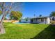 Expansive backyard with lush green lawn and in-ground pool, perfect for outdoor entertaining at 13446 N 18Th Ave, Phoenix, AZ 85029