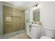 Bathroom with a glass shower, a white vanity, and gold accents at 13446 N 18Th Ave, Phoenix, AZ 85029