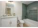 Modern bathroom featuring a bathtub with tile surround, marble countertop, and gold fixtures at 13446 N 18Th Ave, Phoenix, AZ 85029